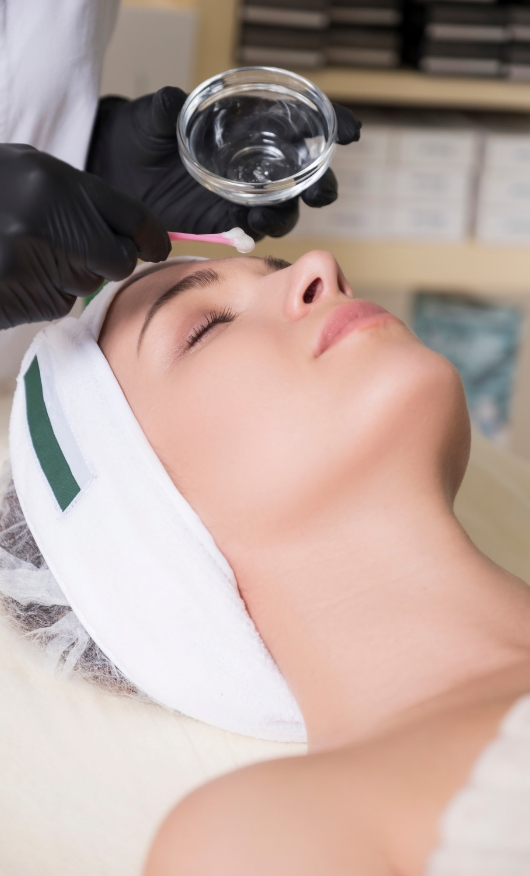 A young lady undergoing a chemical peeling procedure.