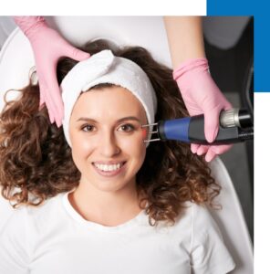 A happy woman undergoing a laser skin care procedure.
