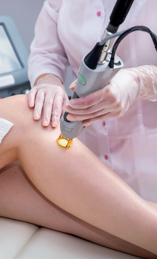 A patient undergoing laser hair removal treatment at a laser skin care clinic.